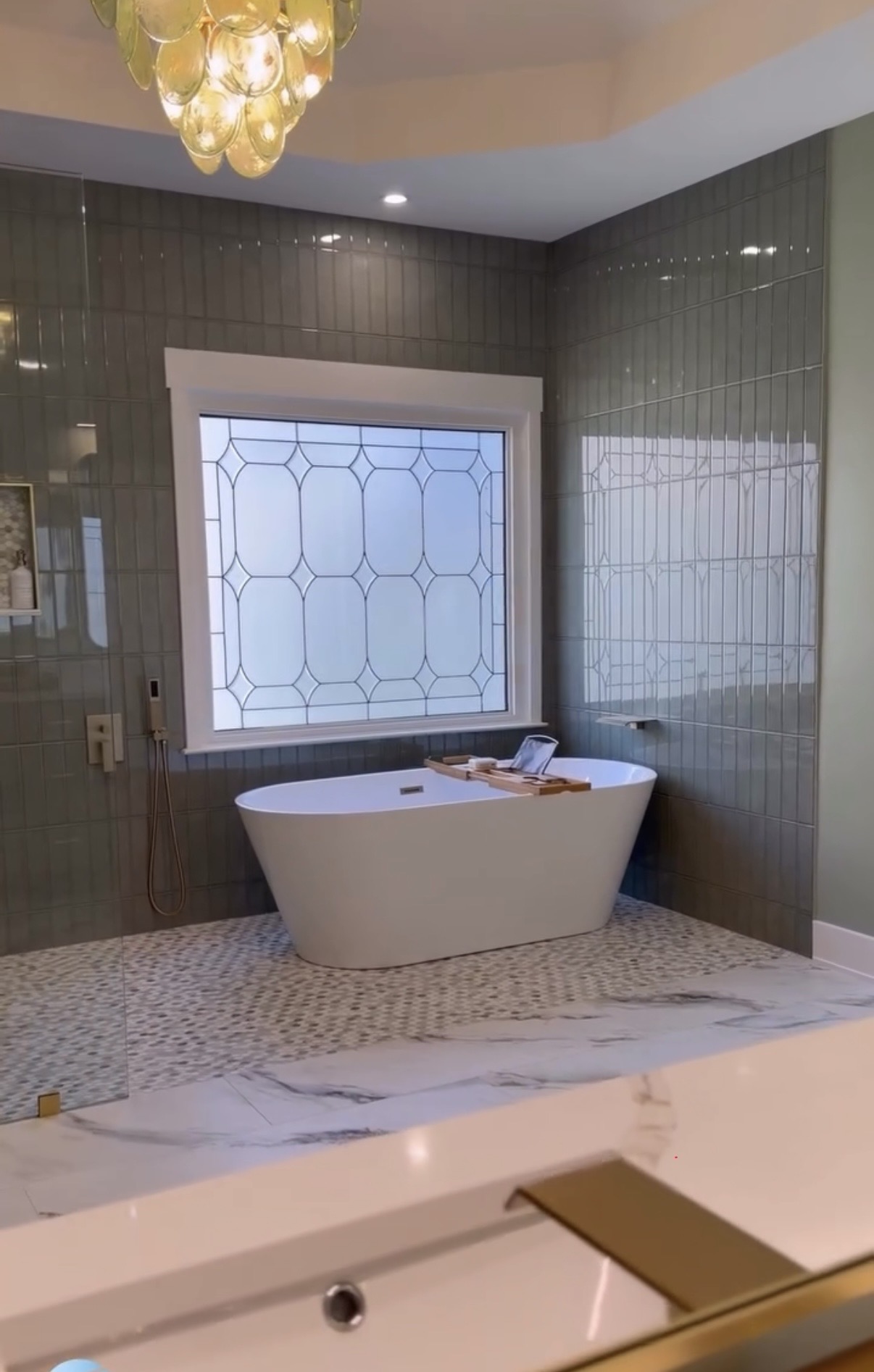 Luxury bathroom with green tile
